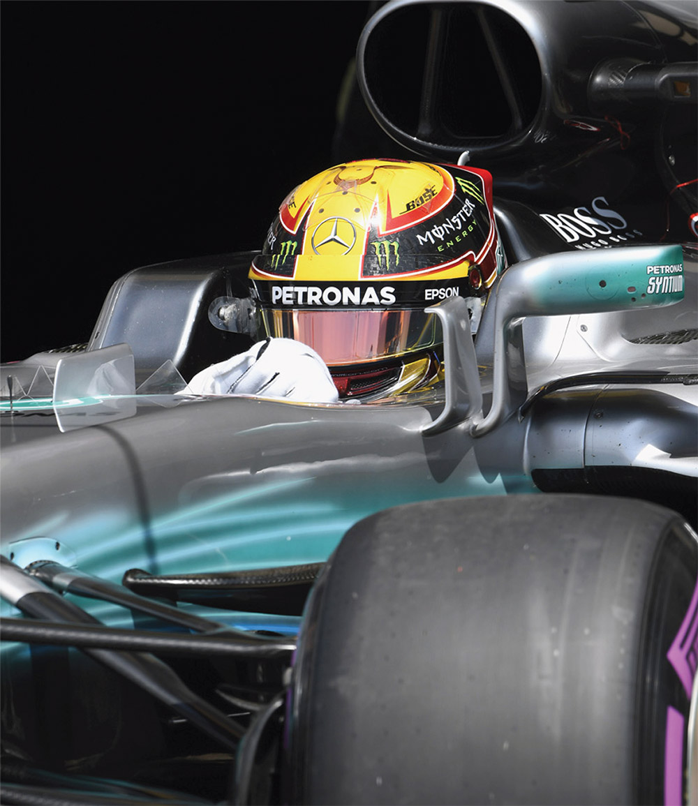 A f1 driver in their car