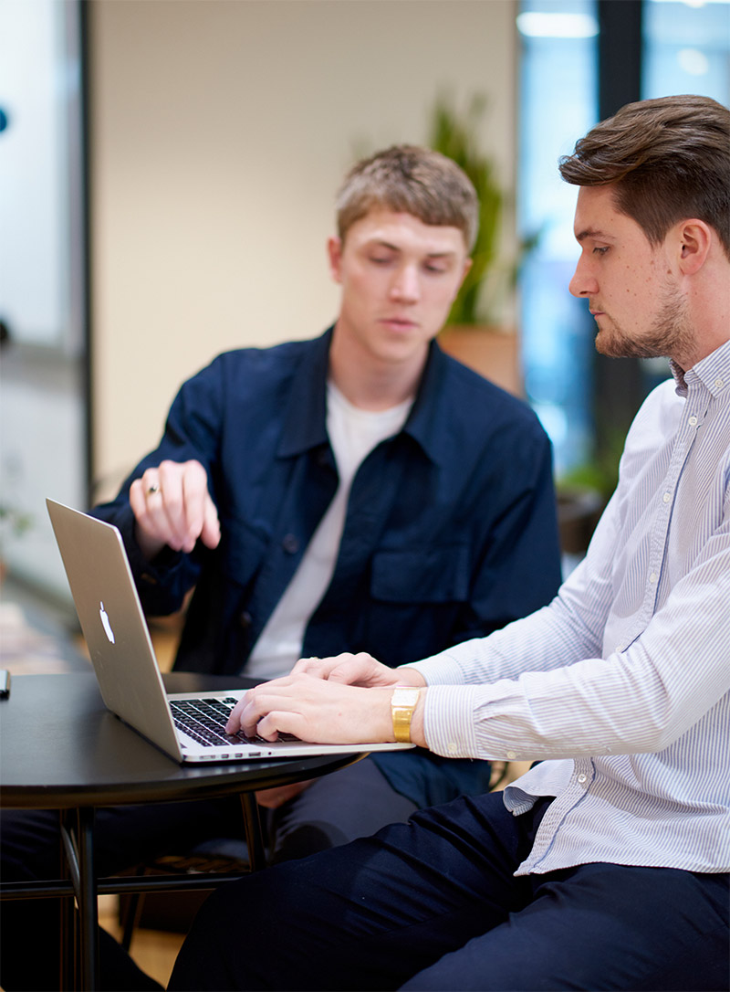 designer and developer collaborating on a website